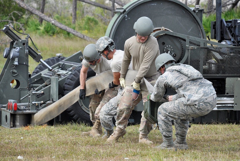 A team of civil engineers tackle a mobile aircraft arresting system, or MAAS, during day four of the Readiness Challenge beta test Oct. 17, 2019, at the Silver Flag exercise site, Tyndall AFB, Florida. (U.S. Air Force photo by David Ford)