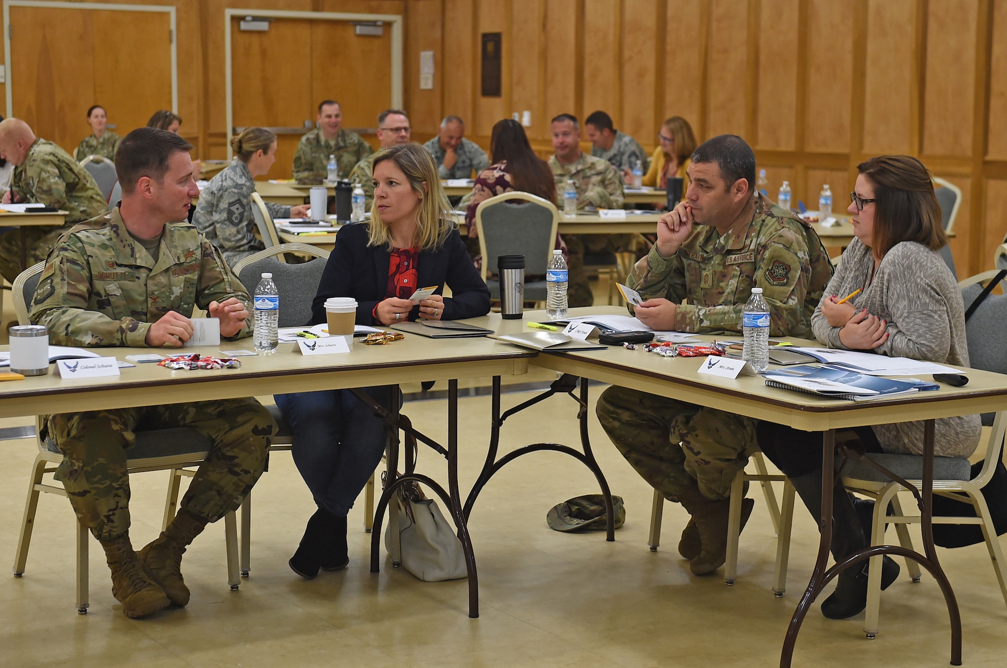 People sit at a table and discuss