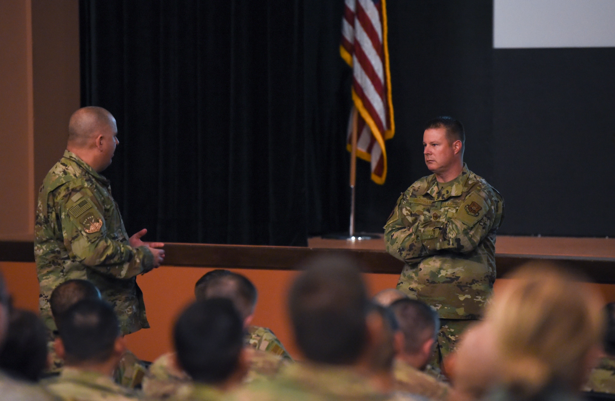 Chief Master Sgt. Charles Hoffman, Air Force Global Strike Command command chief, answers questions from Airmen during an all-call Oct. 17, 2019, at F. E. Warren Air Force Base, Wyo. Hoffman visited many Airmen over his multi-day visit and engaged in conversations with them about Air Force life and leadership. (U. S. Air Force photo by Senior Airman Nicole Reed)