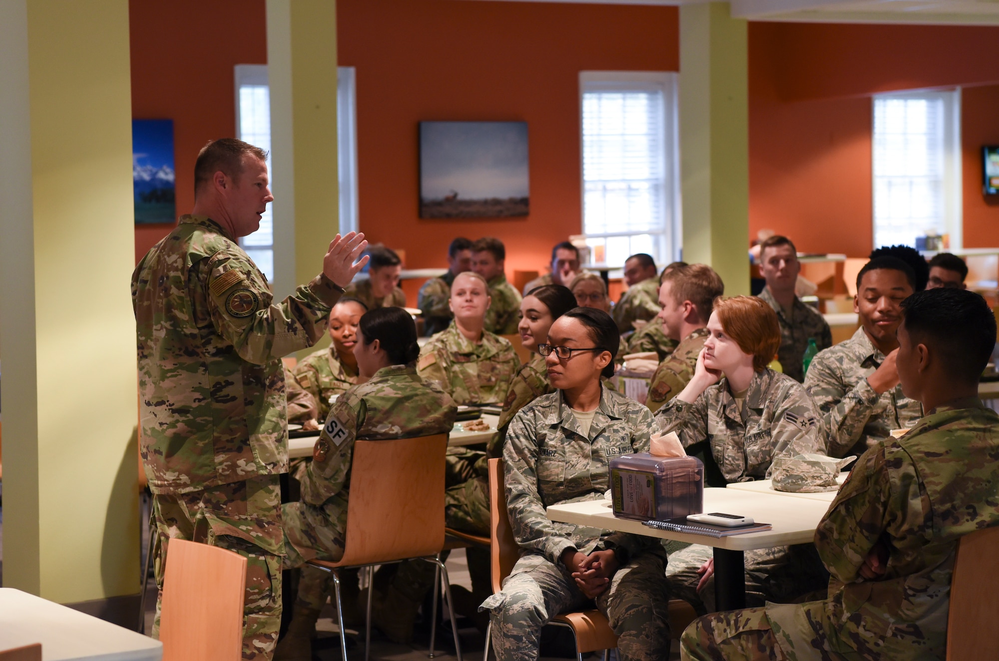 Chief Master Sgt. Charles Hoffman, Air Force Global Strike Command command chief, listens to the thoughts of Airmen during breakfast on Oct. 17, 2019, at F. E. Warren Air Force Base, Wyo. Hoffman visited many shops around base and took a look at some of the Airmen dormitories during his visit. (U. S. Air Force photo by Senior Airman Nicole Reed)