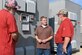 Electricians Lon Britt, left, and Robert Campbell, right, along with electrical engineer Adam Webb look at a rectifier, like one that was responsible for an un-commanded "runaway" condition, outside the AEDC Aerodynamic and Propulsion Test Unit at Arnold Air Force base. Webb improved the logic used in the Programmable Logic Controllers on the units to handle un-commanded "runaways,” which allowed him to identify the part at fault. (U.S. Air Force photo by Jill Pickett) (This image has been altered by obscuring items for security reasons.)