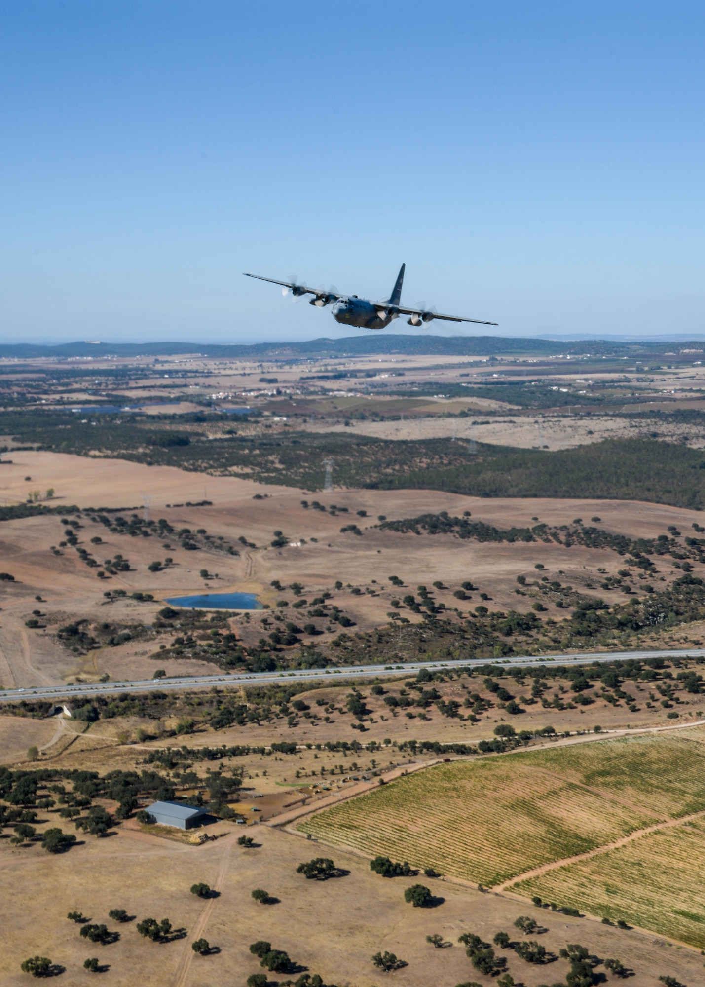 A C-130H3 from Dobbins Air Reserve Base, Georgia, flies near Beja Air Base, Portugal, Sep. 26, 2019 during Exercise Real Thaw 2019 . Real Thaw is a Portuguese-led multi-lateral flying training exercise where Dobbins supports the aerial functions of the exercise. (U.S. Air Force photo/Senior Airman Josh Kincaid)
