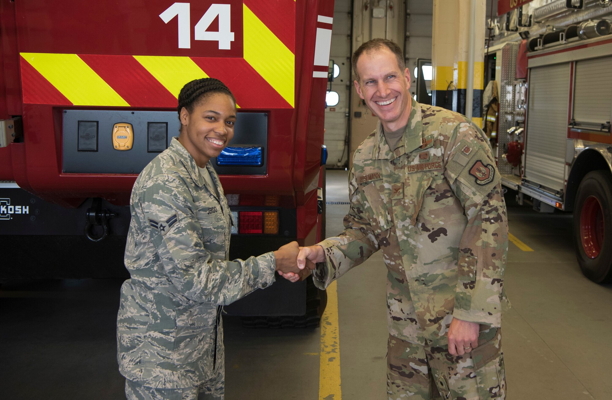 U.S. Air Force Col. Matthew S. Husemann, 86th Airlift Wing vice commander, poses for a photo with Airman 1st Class Kayla T. Jerido, 86th Civil Engineer Squadron fire protection journeyman, to recognize her as the Airlifter of the Week at Ramstein Air Base, Germany, Oct. 18, 2019. Jerido received the award after displaying strong leadership in several different roles within the fire-station. Perhaps most notably was Jerido’s ability to lead a fire station immersion tour for the 20 NATO partner firefighters from Lithuania Romania and Ukraine. (U.S. Air Force photo by Senior Airman Kristof J. Rixmann)