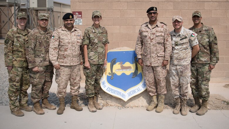 Kuwaiti army doctors and Colonels' Nawaf Jandoul Al-Dousari, right, and Raed R. Altajalli, left, view a specimen of a scorpion during a stop at the public health section of the 386th Expeditionary Medical Group clinic while visiting Ali Al Salem Air Base, Kuwait, Oct. 16, 2019. Al-Dousari and Altajalli, director and assistant director of the North Military Medical Complex respectively, visited the 386th EMDG clinic to tour the facility, share ideas on improving medical care and discuss strengthening interoperability. (U.S. Air Force photo by Tech. Sgt. Daniel Martinez)