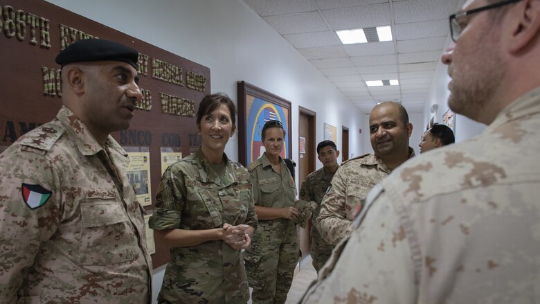 U.S. Air Force Master Sgt. Yaneesa Simpson, 386th Expeditionary Medical Group medical technician, explains the 9-line medevac request process to Kuwait army Col. Nawaf Jandoul Al-Dousari, North Military Medical Complex director, during his tour of the 386th EMDG clinic at Ali Al Salem Air Base, Kuwait, Oct. 16, 2019. The Kuwait army directors of the North Military Medical Complex visited the 386th EMDG clinic to tour the facility, share ideas on improving medical care and discuss strengthening interoperability. (U.S. Air Force photo by Tech. Sgt. Daniel Martinez)