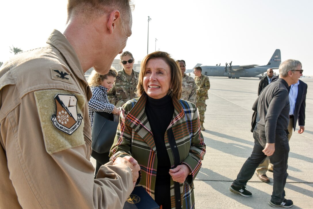 Speaker of the U.S. House of Representatives Nancy Pelosi thanks Col. Ben Jonsson, 379th Air Expeditionary Wing vice commander, during a congressional delegation visit at Al Udeid Air Base, Qatar on Oct. 21, 2019. The delegation also included members of the House Committee of Foreign Affairs, House Homeland Security Committee, House Permanent Select Committee on Intelligence, House Armed Services Committee, House Ways and Means Committee and House Committee on Oversight and Government Reform. (U.S. Air Force photo by Tech. Sgt. John Wilkes)