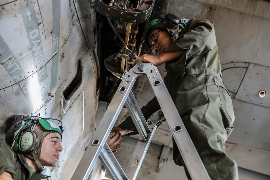U.S. Marine Corps Pfc. Jake Fortune (left) and Lance Cpl. Francisco Salas (right), tiltrotor mechanics with Marine Medium Tiltrotor Squadron 166, Marine Aircraft Group 16, 3rd Marine Aircraft Wing, perform maintenance on an MV-22B Osprey at Marine Corps Air Station Miramar, Calif., Oct. 21, 2019. As America’s “Force in Readiness,” 3rd MAW’s Marines remain ready to respond to crises anytime, anywhere. (Marine Corps photo by Lance Cpl. Jacob Pruitt)