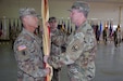 Maj. Gen. Greg Mosser, commanding general of the 377th Theater Sustainment Command, Belle Chasse, La., passes the Army Reserve Sustainment Command’s colors to Brig. Gen. Donald Absher charging him with the responsibility and authority of the ARSC during an Assumption of Command Ceremony on October 20, 2019.