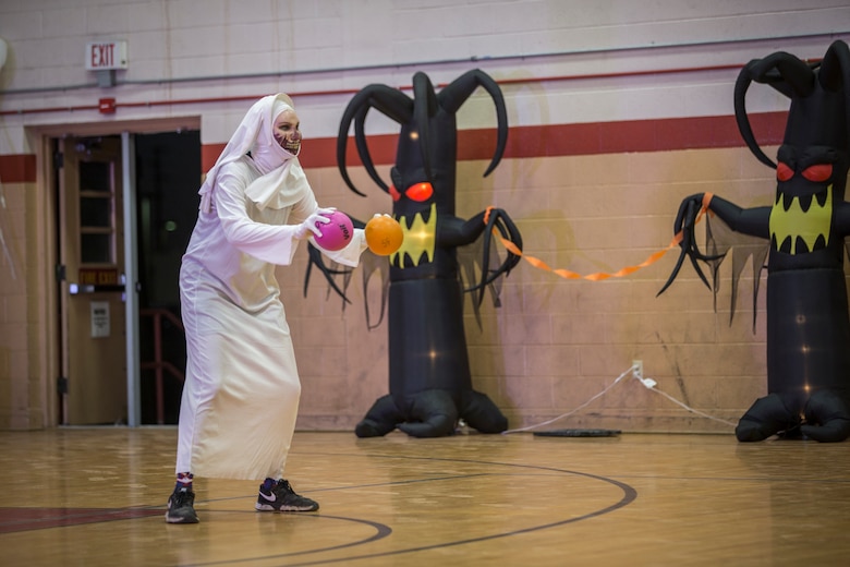 U.S. Marines with Marine Corps Air Station (MCAS) Yuma, compete in the annual "Dodge of the Dead" dodgeball tournament at the gymnasium aboard MCAS Yuma, Ariz., Oct. 15, 2019. The Single Marine Marine Program sponsored event pitted teams of 6 costume clad service members against each other in a fierce competition. (U.S. Marine Corps photo by Lance Cpl John Hall)