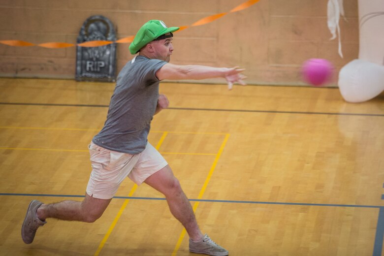 U.S. Marines with Marine Corps Air Station (MCAS) Yuma, compete in the annual "Dodge of the Dead" dodgeball tournament at the gymnasium aboard MCAS Yuma, Ariz., Oct. 15, 2019. The Single Marine Marine Program sponsored event pitted teams of 6 costume clad service members against each other in a fierce competition. (U.S. Marine Corps photo by Lance Cpl John Hall)