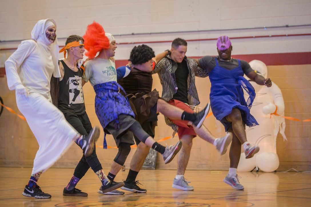 U.S. Marines with Marine Corps Air Station (MCAS) Yuma, compete in the annual "Dodge of the Dead" dodgeball tournament at the gymnasium aboard MCAS Yuma, Ariz., Oct. 15, 2019. The Single Marine Marine Program sponsored event pitted teams of 6 costume clad service members against each other in a fierce competition. (U.S. Marine Corps photo by Lance Cpl John Hall)