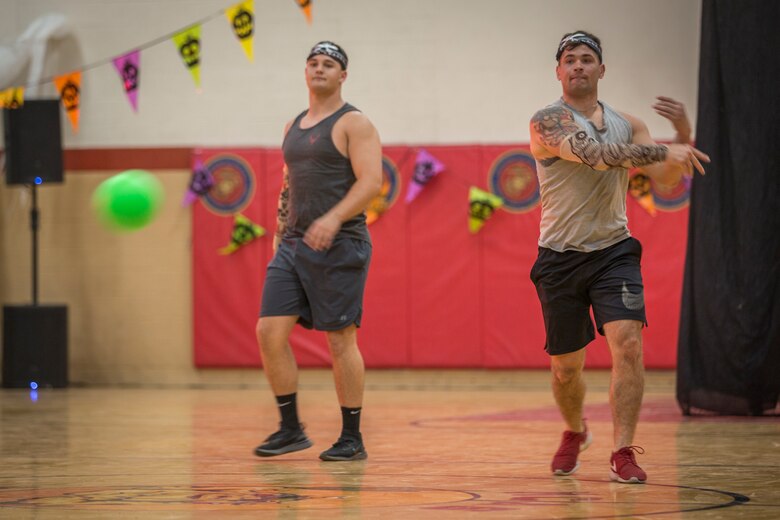 U.S. Marines with Marine Corps Air Station (MCAS) Yuma, compete in the annual "Dodge of the Dead" dodgeball tournament at the gymnasium aboard MCAS Yuma, Ariz., Oct. 15, 2019. The Single Marine Marine Program sponsored event pitted teams of 6 costume clad service members against each other in a fierce competition. (U.S. Marine Corps photo by Lance Cpl John Hall)