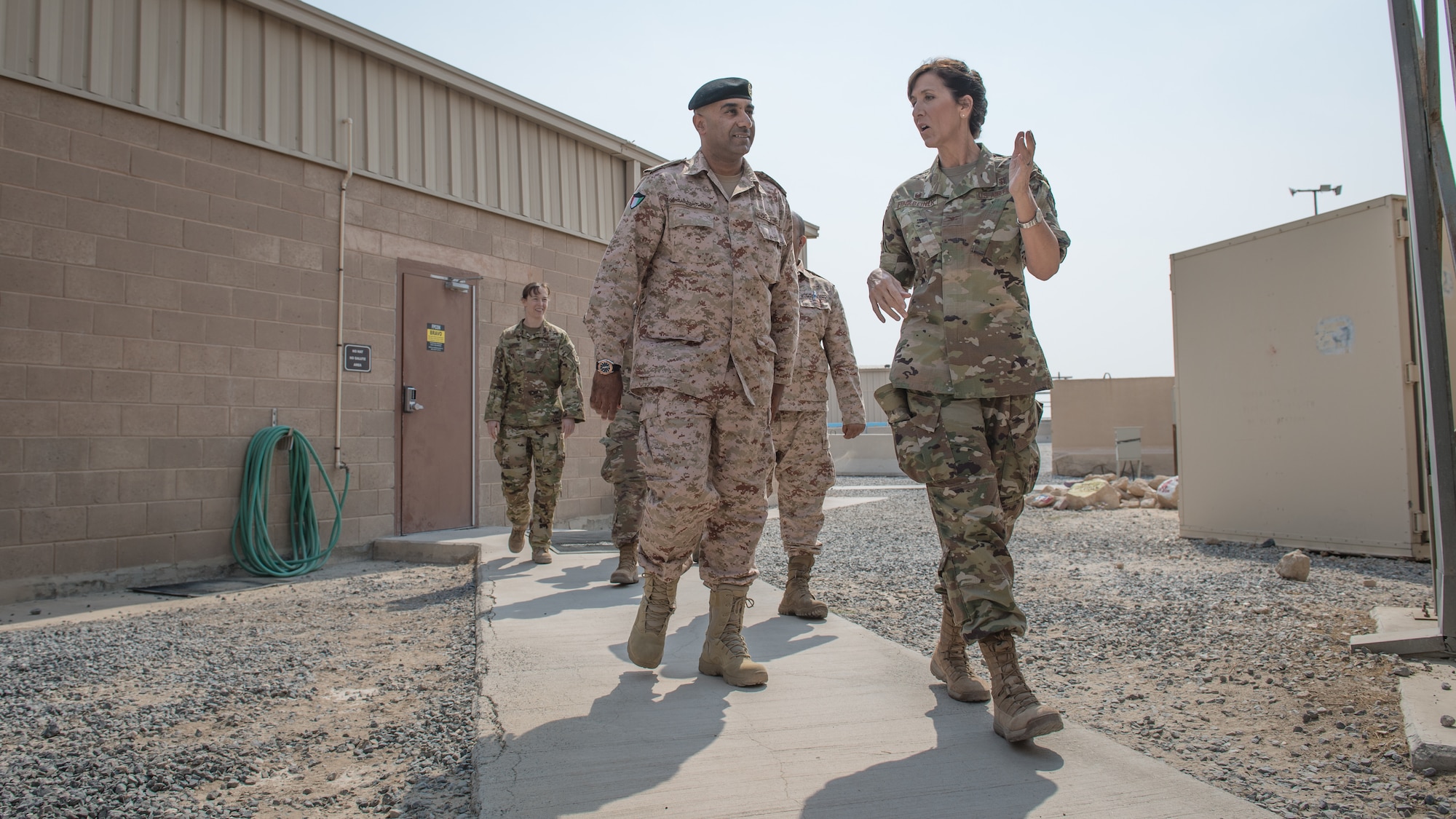 U.S. Air Force Col. Courtney Finkbeiner, right, 386th Expeditionary Medical Group commander, talks with Kuwait army Col. Nawaf Jandoul Al-Dousari, North Military Medical Complex director, while taking a tour of the 386th EMDG base clinic at Ali Al Salem Air Base, Kuwait, Oct. 16, 2019. The Kuwait army directors of the North Military Medical Complex visited the 386th EMDG clinic to tour the facility, share ideas on improving medical care and discuss strengthening interoperability. (U.S. Air Force photo by Tech. Sgt. Daniel Martinez)