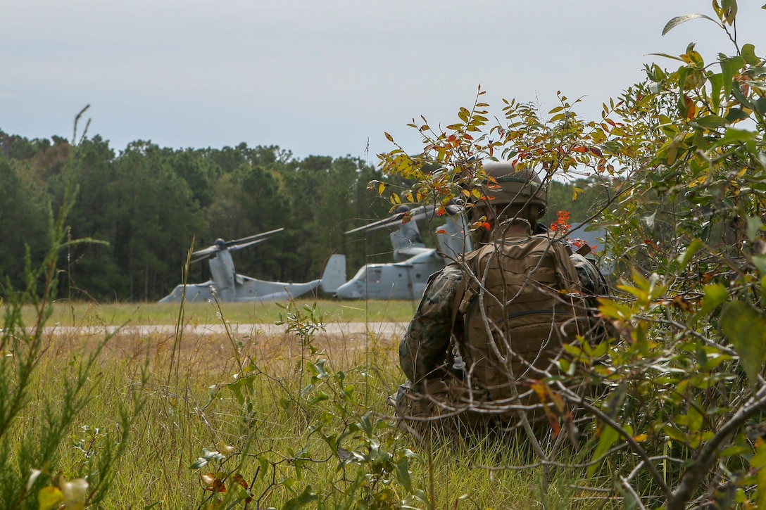 U.S. Marines with Weapons Company, Battalion Landing Team, 2nd Battalion, 8th Marine Regiment, 26th Marine Expeditionary Unit (MEU), provide security during a Tactical Recovery of Aircraft and Personnel mission as part of Composite Training Unit Exercise (COMPTUEX) in the vicinity of Camp Lejeune, North Carolina, Oct. 19, 2019. Bataan is underway conducting a COMPTUEX with the Bataan Amphibious Ready Group and 26th MEU. (U.S. Marine Corps photo by Lance Cpl. Gary Jayne III)