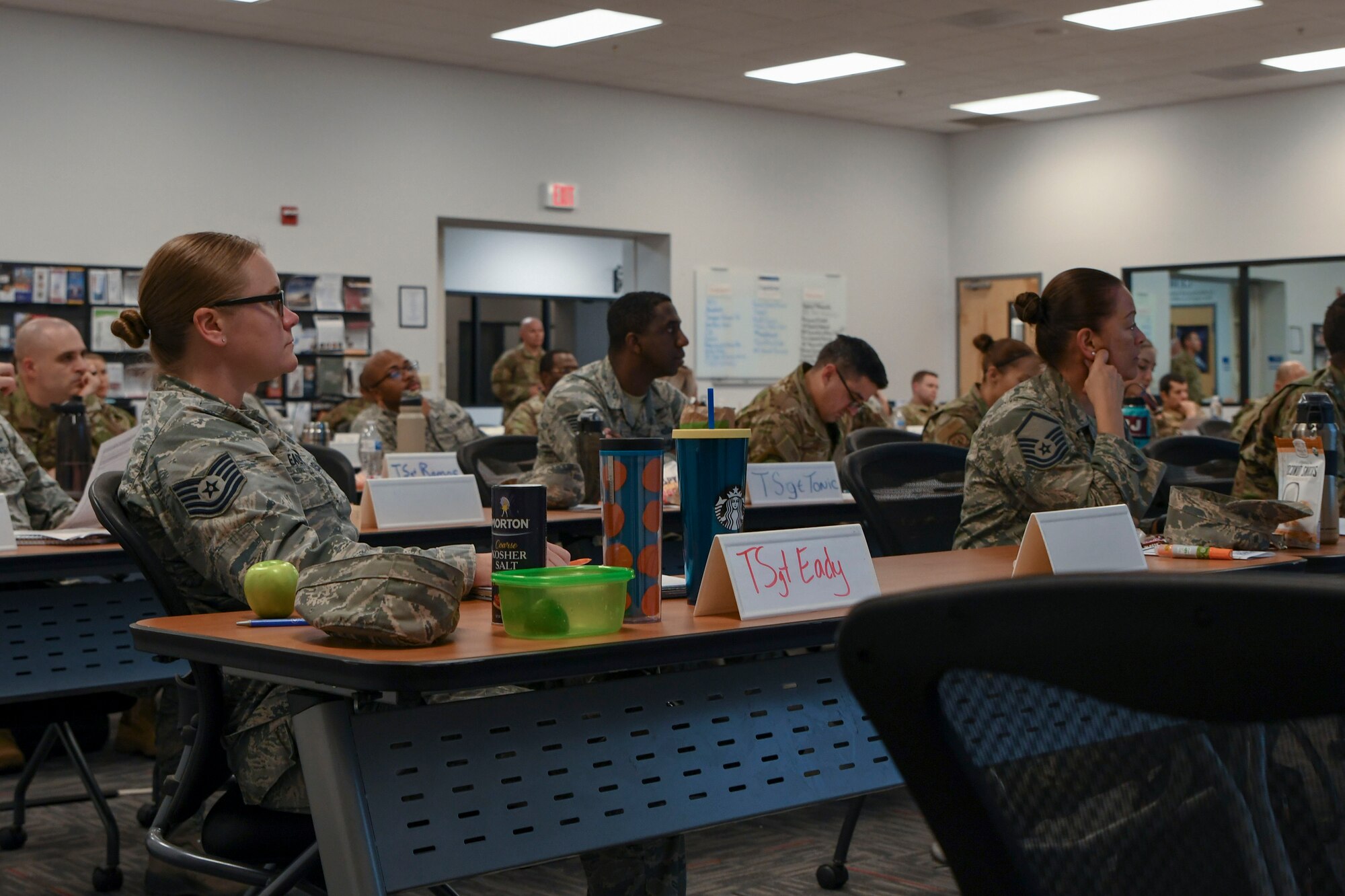 Airmen listen to instruction
