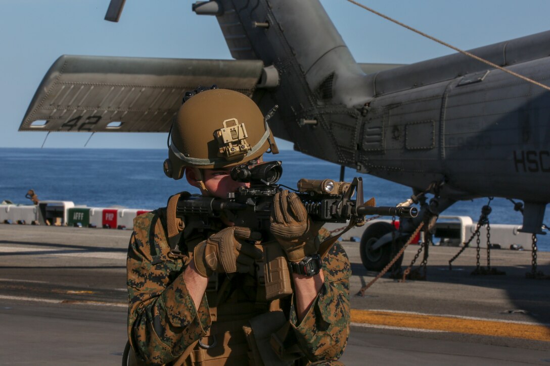U.S. Marines with Fox Company, Battalion Landing Team, 2nd Battalion, 8th Marine Regiment, 26th Marine Expeditionary Unit (MEU), conduct fire team drills on the flight deck of the amphibious assault ship USS Bataan (LHD 5) during Composite Training Unit Exercise (COMPTUEX) in the Atlantic Ocean Oct. 12, 2019. Bataan is underway conducting a COMPTUEX with the Bataan Amphibious Ready Group and 26th MEU. (U.S. Marine Corps photo by Lance Cpl. Gary Jayne III)