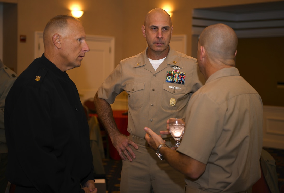 Navy Command Master Chief Christopher W. Moore and Marine Corps Sgt. Maj. Peter A. Siaw speak during the Sergeant Major of the Marine Corps Symposium in Quantico, Va., Oct. 17, 2019. The Sergeant Major of the Marine Corps Symposium is an annual event for Marine Corps Sergeants Major to gather and discuss Corps readiness, safety and future operations.