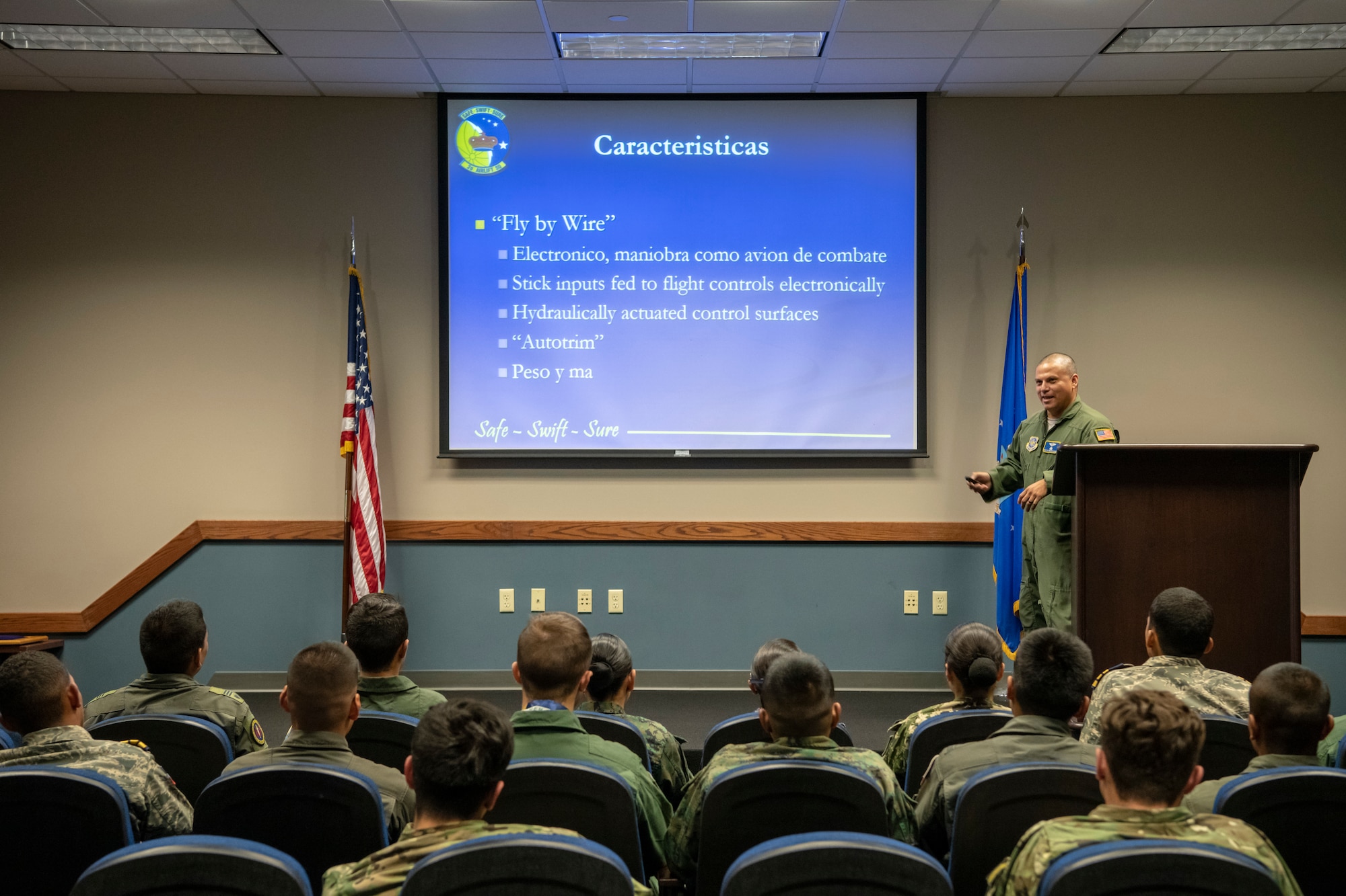 Master Sgt. Levy Menjivarsanchez, 3rd Airlift Wing loadmaster, briefs the Latin American cadets as part of their tour Oct. 17, 2019, at Dover Air Force Base, Del. The informational slides for the brief on the C-17 Globemaster III were in Spanish to accommodate the cadets. (U.S. Air Force photo by Senior Airman Christopher Quail)