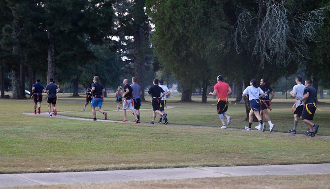 Participants begin running at the Zombie Fun Run Sept. 27, 2019, on Columbus Air Force Base, Miss. The run consisted of a 2-mile run along the BLAZE Fit Trail with four infected zones for runners to try to escape from the living dead. (U.S. Air Force photo by Airman 1st Class Hannah Bean)