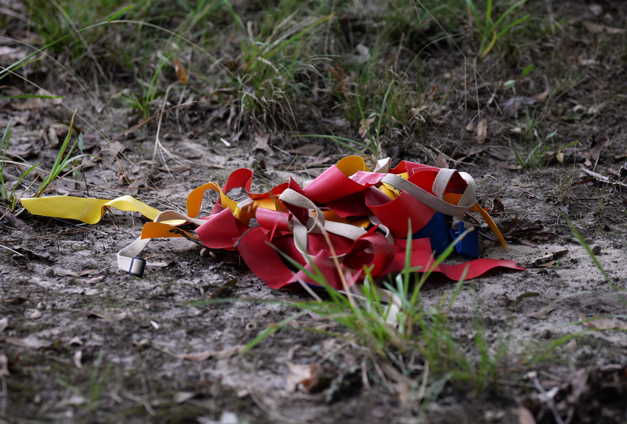 A pile of flags sits near the BLAZE Fit Trail at the Zombie Run Sept. 27, 2019, on Columbus Air Force Base, Miss. Zombies were challenged with capturing as many flags from the runners throughout the four infected zones. (U.S. Air Force photo by Airman 1st Class Hannah Bean)