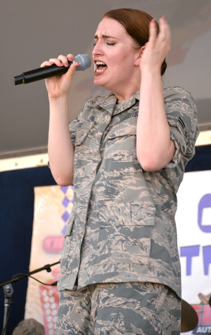 Airman 1st Class Leah Fox, vocalist with the U.S. Air Force Band of the West's Warhawk band, belts out one with feeling during the JBSA-Fort Sam Houston Oktoberfest celebration Oct. 19.