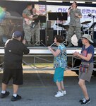 Attendees at the 2019 Joint Base San Antonio-Fort Sam Houston Oktoberfest celebration get down and get funky to the music of the Air Force Band of the West's Warhawk band Oct. 19.