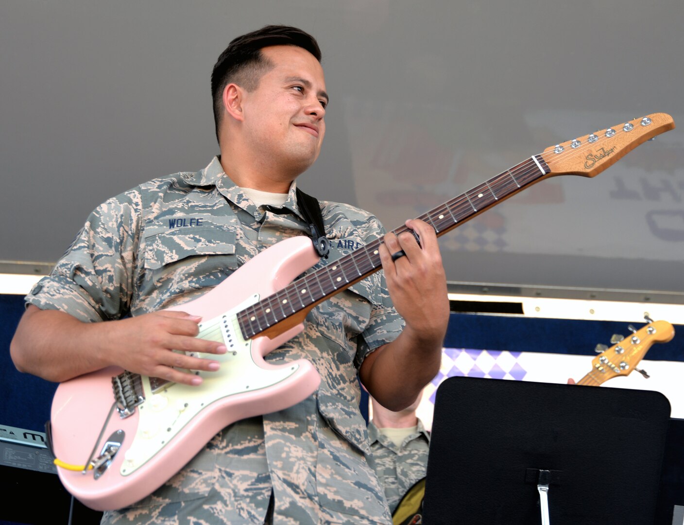 Staff Sgt. Robert Wolfe, guitarist with the Air Force Band of the West's Warhawk band, rips out a riff during the 2019 Joint Base San Antonio-Fort Sam Houston Oktoberfest celebration.