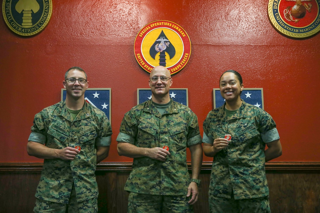 (From left to right) U.S. Marine Corps Capt. Sean Wetherill, Maj. Bryan Boyle, both Maritime Preposition Force Staff Planning Course instructors, and Pfc. Leslie Bowie, a logistics embarkation specialist with 2nd Marine Expeditionary Brigade, G-4, pose for a photo during the MPF Staff Planning Course at Camp Lejeune, N.C., Oct. 11, 2019. This was an annual training course intended to help align II Marine Expeditionary Force and 2nd Marine Expeditionary Brigade with the Commandant’s Planning Guidance. (U.S. Marine Corps photo by Cpl. Stephen Campbell)