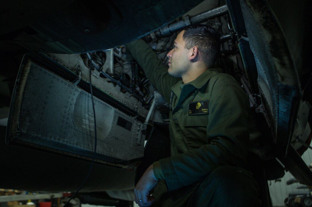 Marine Sgt. Cesar Garcia performs preventative maintenance on an AV-8B Harrier II during exercise Banzai Badlands in Sioux Falls, S.D., Oct. 11, 2019. Marine Attack Squadron 231 and the 114th Fighter Wing of the South Dakota Air National Guard participated in a three-day exercise consisting of simulated air-to-air combat and air-to-ground strikes. Garcia is an avionic technician with VMA-231, Marine Aircraft Group 14, 2nd Marine Aircraft Wing. (U.S. Marine Corps photo by Lance Cpl. Gavin Umboh)