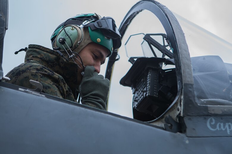 Marine Sgt. Cesar Garcia performs preventative maintenance on an AV-8B Harrier II during exercise Banzai Badlands in Sioux Falls, S.D., Oct. 11, 2019. Marine Attack Squadron 231 and the 114th Fighter Wing of the South Dakota Air National Guard participated in a three-day exercise consisting of simulated air-to-air combat and air-to-ground strikes. Garcia is an avionic technician with VMA-231, Marine Aircraft Group 14, 2nd Marine Aircraft Wing. (U.S. Marine Corps photo by Lance Cpl. Gavin Umboh)