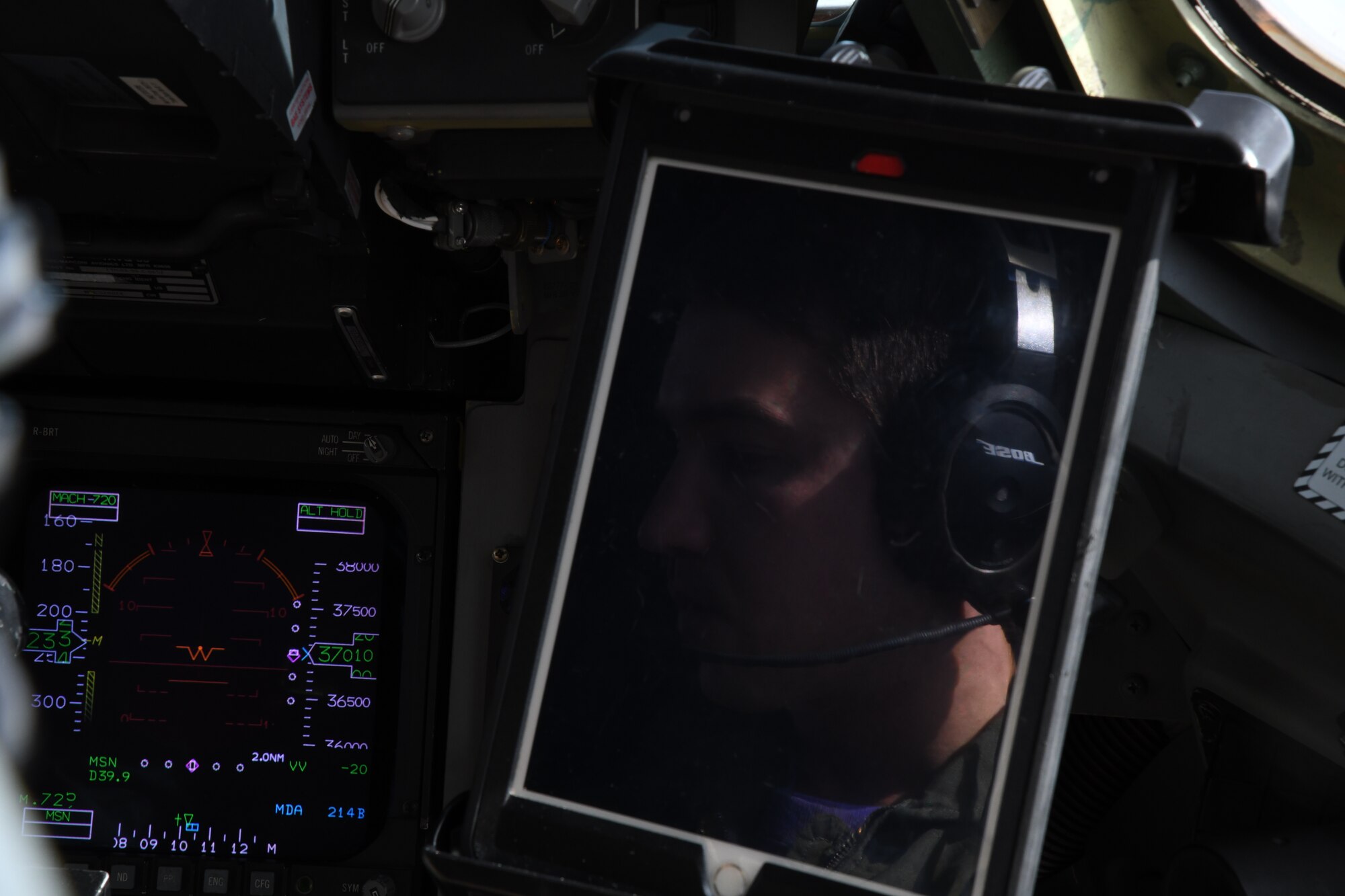 Capt. Kyle Evans, 3rd Airlift Squadron pilot, reviews his flight instruments during a training flight aboard a C-17 Globemaster III Oct. 16, 2019, at Laguna Army Airfield in Yuma Proving Ground, Ariz. Pilots from the 3AS, Dover Air Force Base, Del., and 21st Airlift Squadron, Travis Air Force Base, Calif., conducted low altitude training during Weapons and Tactics Instructor Course 1-20. WTI is a seven-week training event hosted by Marine Aviation Weapons and Tactics Squadron One, which emphasizes operational integration of the six functions of Marine Corps aviation in support of a Marine Air Ground Task Force. (U.S. Air Force Photo by Tech Sgt. Esteban Esquivel)
