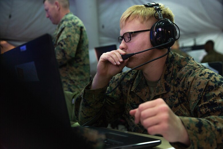 Marine Cpl. Brandon T. Hill performs a communications check during Exercise Pegasus Flight at Marine Corps Air Station Cherry Point, North Carolina, Sept. 30, 2019. Marine Tactical Air Command Squadron 28 supported Pegasus Flight by planning, commanding, directing and supervising all air operations as the tactical air command center for the exercise. Hill is an air support operations operator with MTACS-28, Marine Air Control Group 28, 2nd Marine Aircraft Wing. (U.S. Marine Corps photo by Pfc. Steven M. Walls)