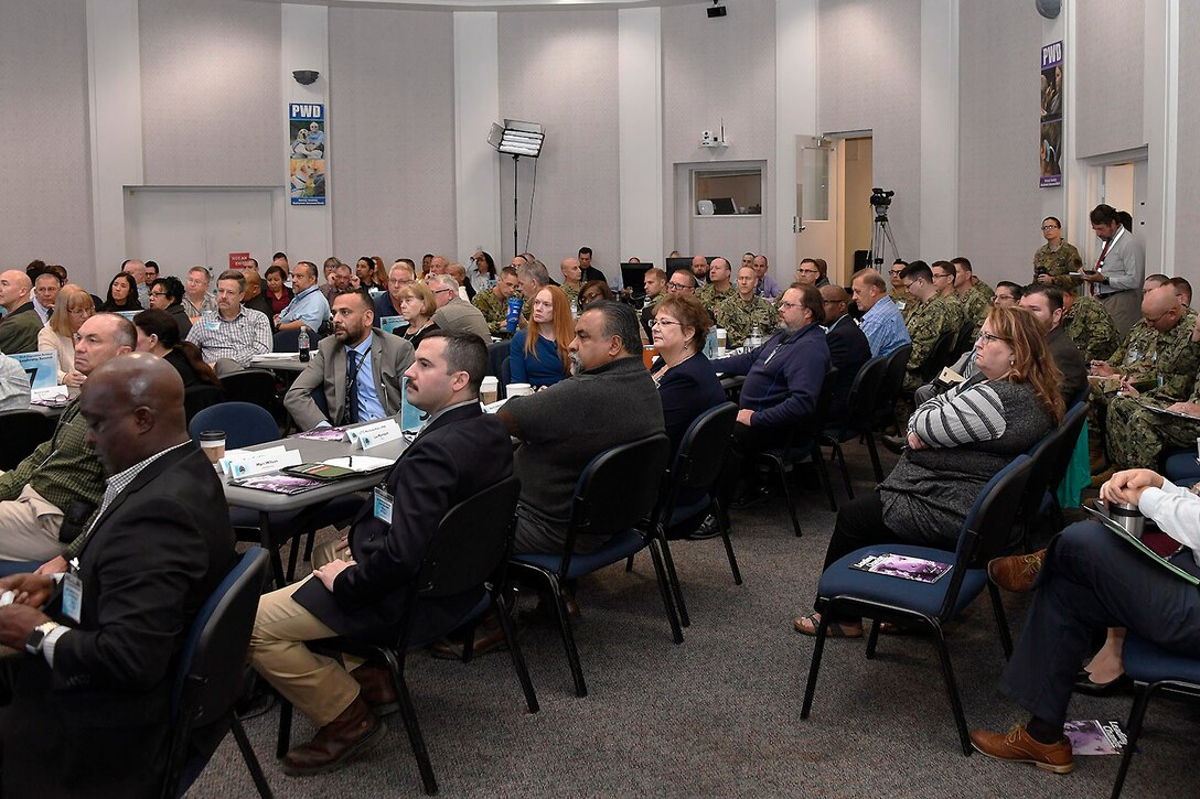 Senior staff members, regional directors, area managers and Disposal Support Unit leaders listen during the address.