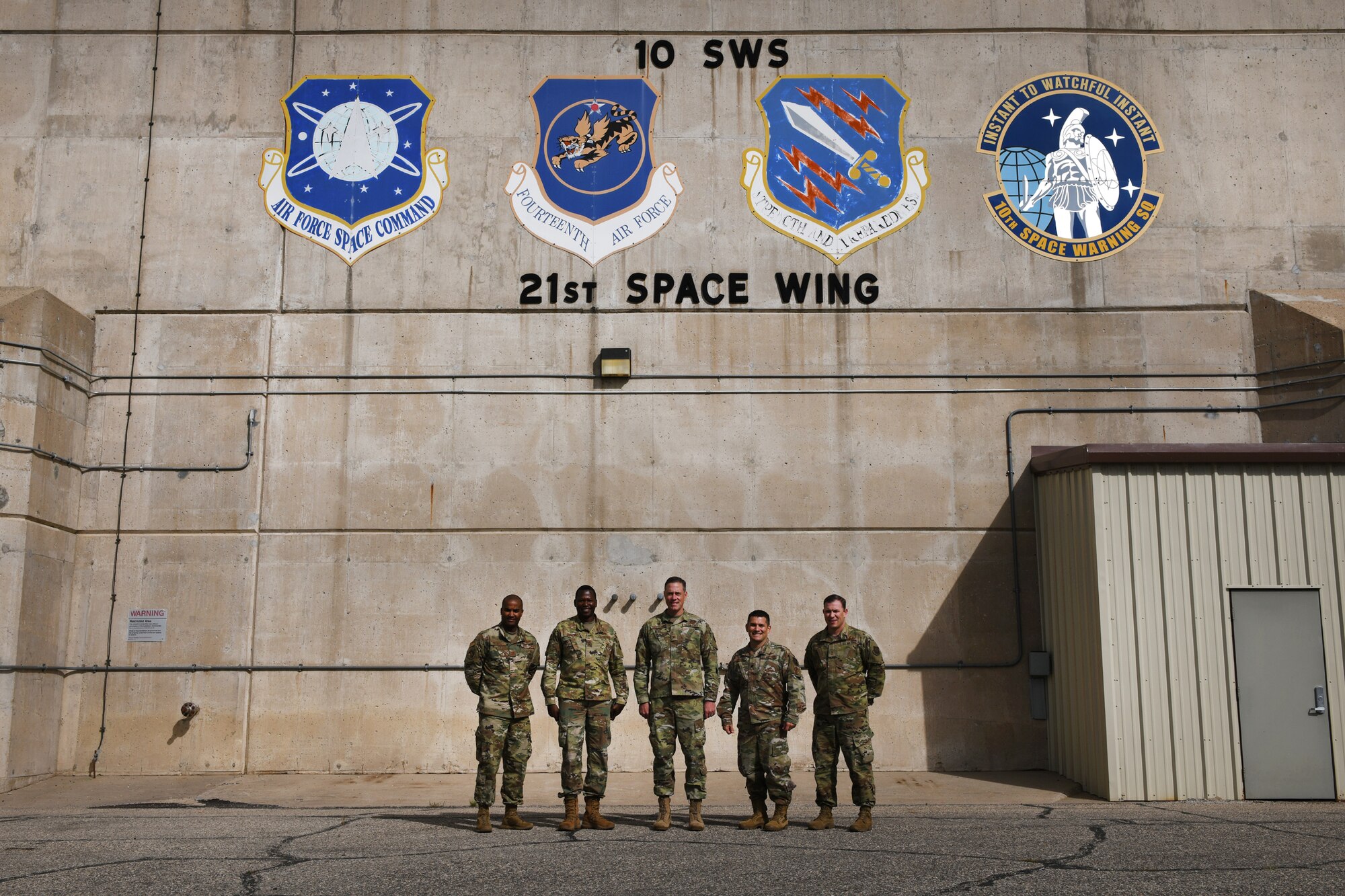Leadership from the 21st Space Wing and 10th Space Warning Squadron pose in front of the Perimeter Acquisition Radar Attack Characterization System Sept. 27, 2019, on Cavalier Air Force Station, North Dakota. The PARCS plays a pivotal role in providing missile warning and space surveillance. (U.S. Air Force photo by Airman 1st Class Andrew Bertain)