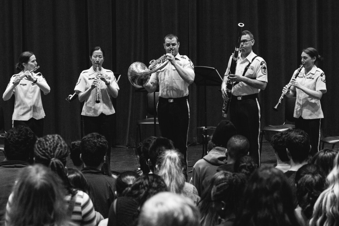 The Academy Winds-- a woodwind quintet of horn, clarinet, flute, bassoon, and oboe-- perform for a crowd of high school students in Atlanta, Georgia during a Concert Band recruiting tour on April 8, 2019.