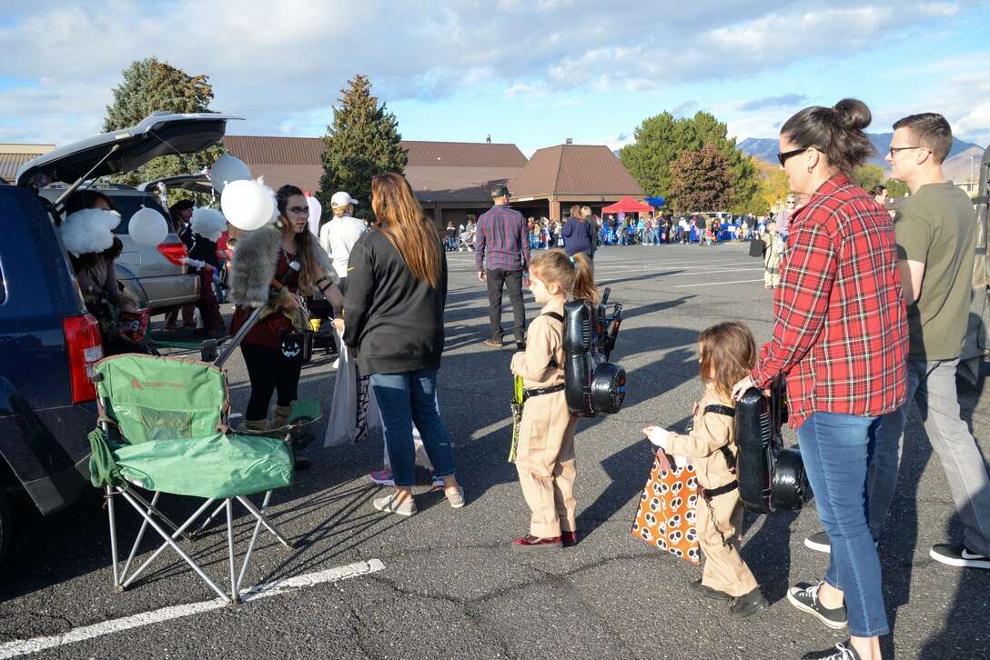 Families walk around and receive candy during the Haunting on the Hill celebration Oct. 18, 2019, at Hill Air Force Base, Utah. The event is organized by the 75th Force Support Squadron. (U.S. Air Force photo by Cynthia Griggs)