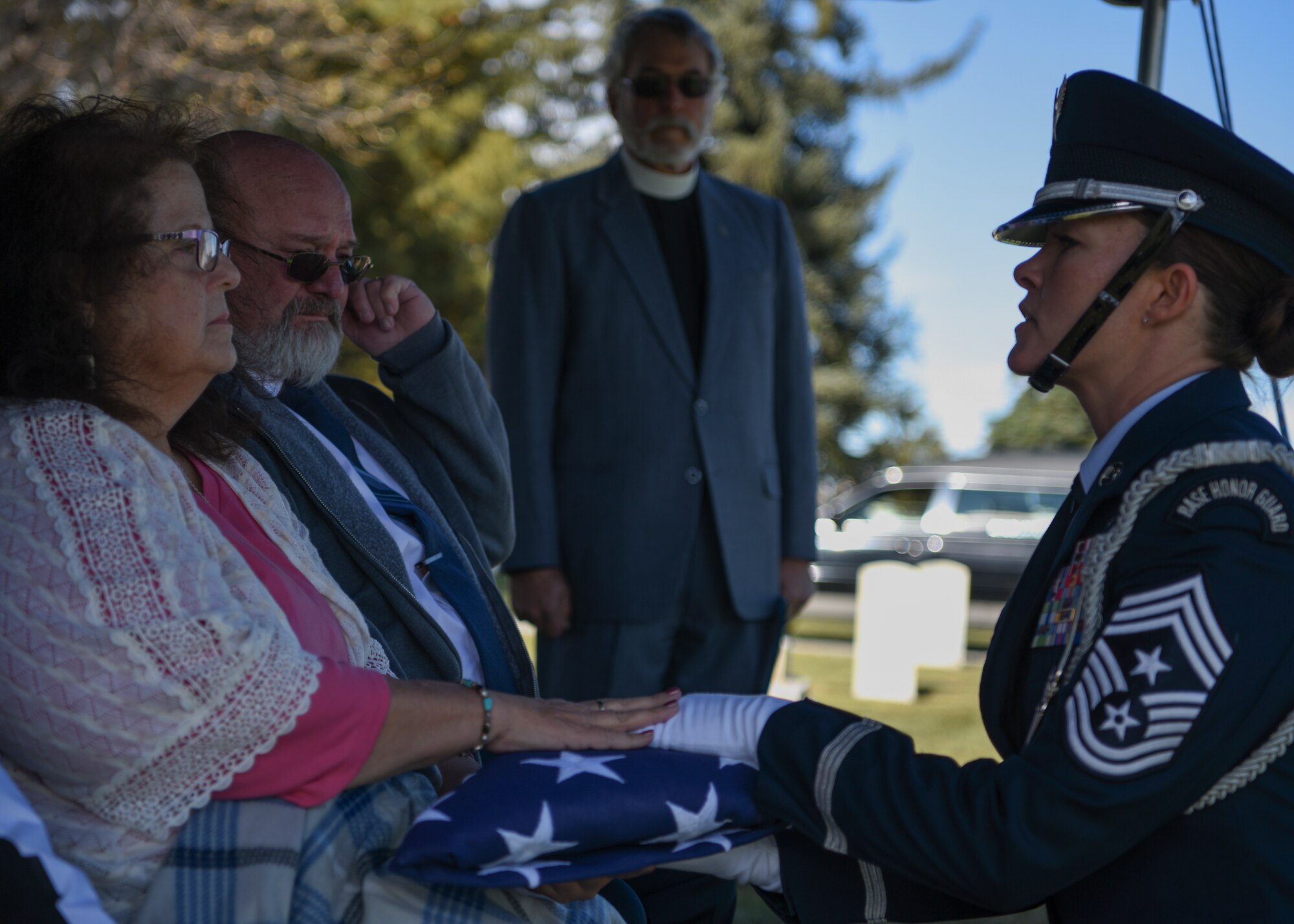 Chief Master Sgt. Tiffany Bettisworth, 90th Missile Wing command chief, presents the American flag to retired Master Sgt. Robert Meadows next-of-kin, on Oct. 22, 2019, on F.E. Warren Air Force Base, Wyo. While serving, Meadows provided critical, high precision geospatial and geophysical information for defense and intelligence needs around the world. (U.S. Air Force photo by Senior Airman Nicole Reed)