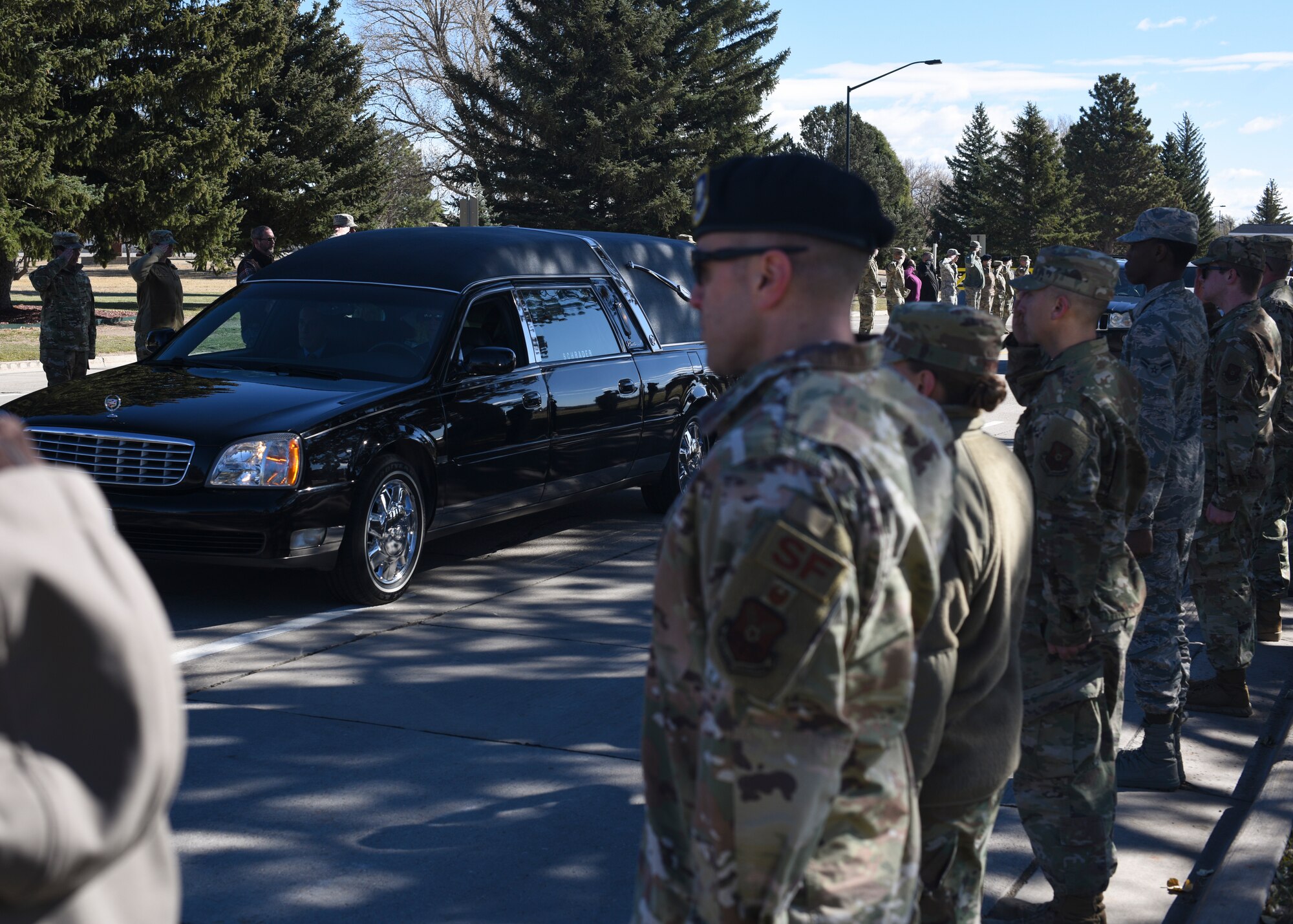 Airmen and staff members give retired Master Sgt. Robert Meadows a final salute as he enters the base for the last time on Oct. 22, 2019, on F.E. Warren Air Force Base, Wyo. Meadows served 20 years in the Air Force, retiring from the 1381st Geodetic Survey Squadron in 1966.(U.S. Air Force photo by Staff Sgt. Ashley N. Sokolov)