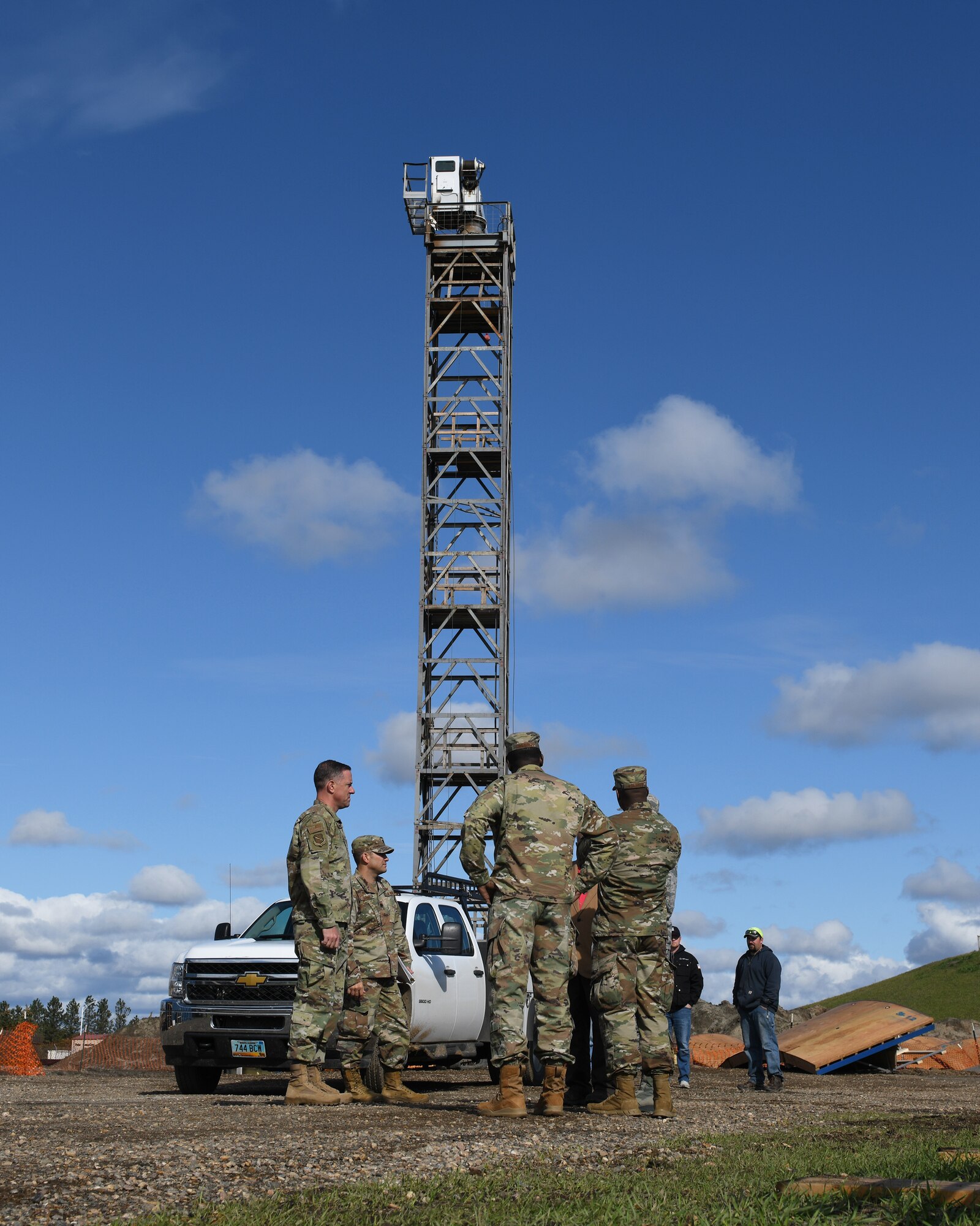 Col. Thomas Falzarano, 21st Space Wing commander, oversees the construction of a new water tower Sept. 27, 2019, on Cavalier Air Force Station, North Dakota. Once completed, the water tower will be the tallest structure on the installation. (U.S. Air Force photo by Airman 1st Class Andrew Bertain)