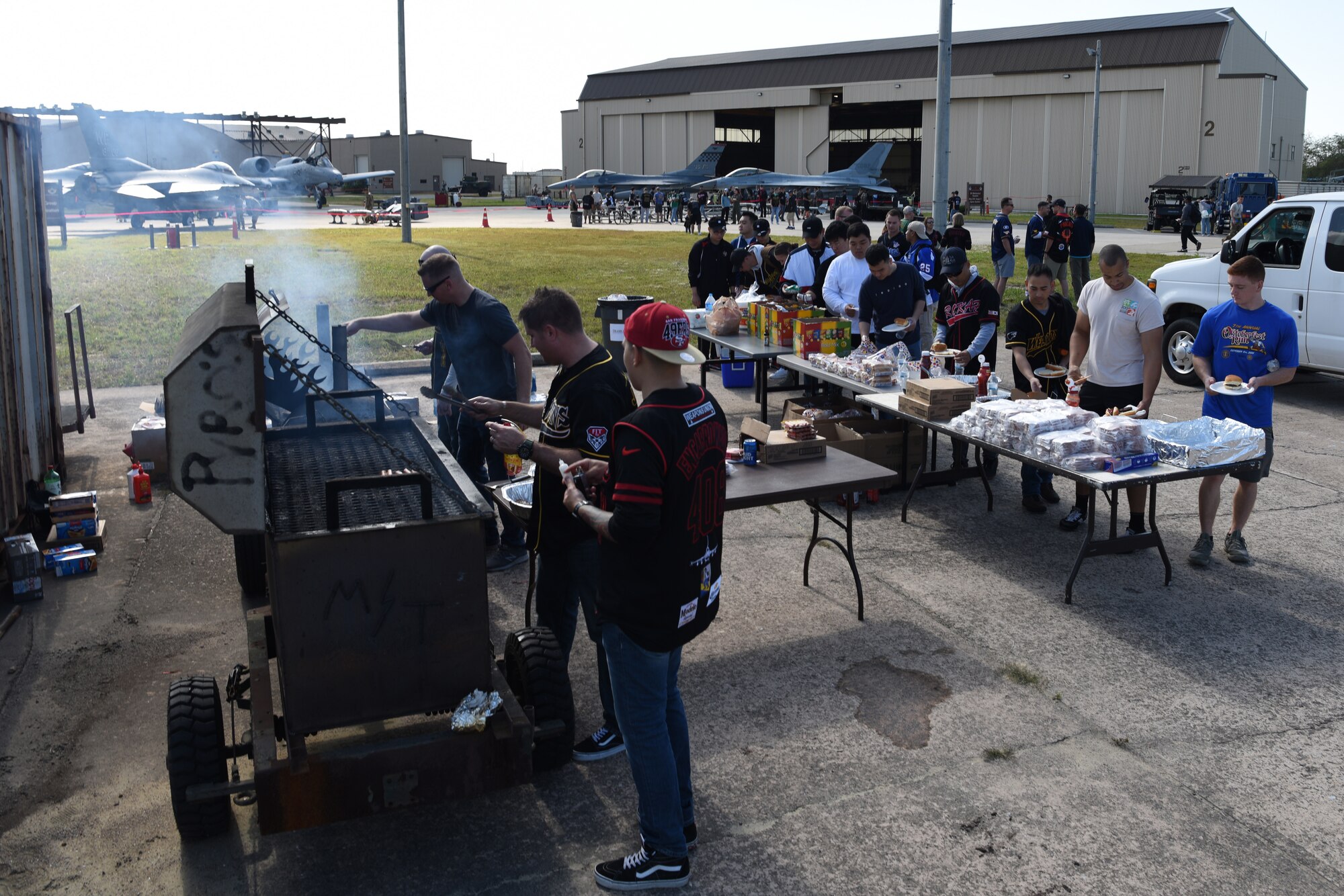 The 8th Maintenance Group provides free food during the 2019 Penn Fest at Kunsan Air Base, Republic of Korea, Oct. 19, 2019. The 8th MXG invited the ROK air force and Osan Air Base partners to compete in a load crew competition. (U.S. Air Force photo by Staff Sgt. Joshua Edwards)