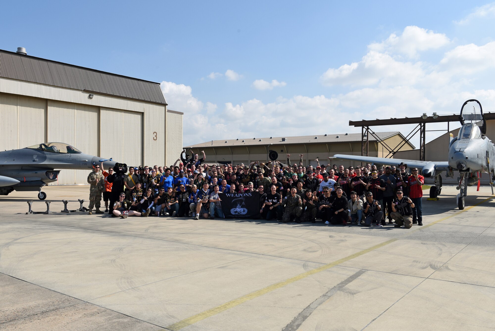 U.S. Air Force and Republic of Korea air force members pause for a photo after the 2019 Penn Fest competition at Kunsan Air Base, ROK, Oct. 19, 2019. Penn Fest brought together five teams to compete in a friendly load crew competition with their international partners. (U.S. Air Force photo by Staff Sgt. Joshua Edwards)