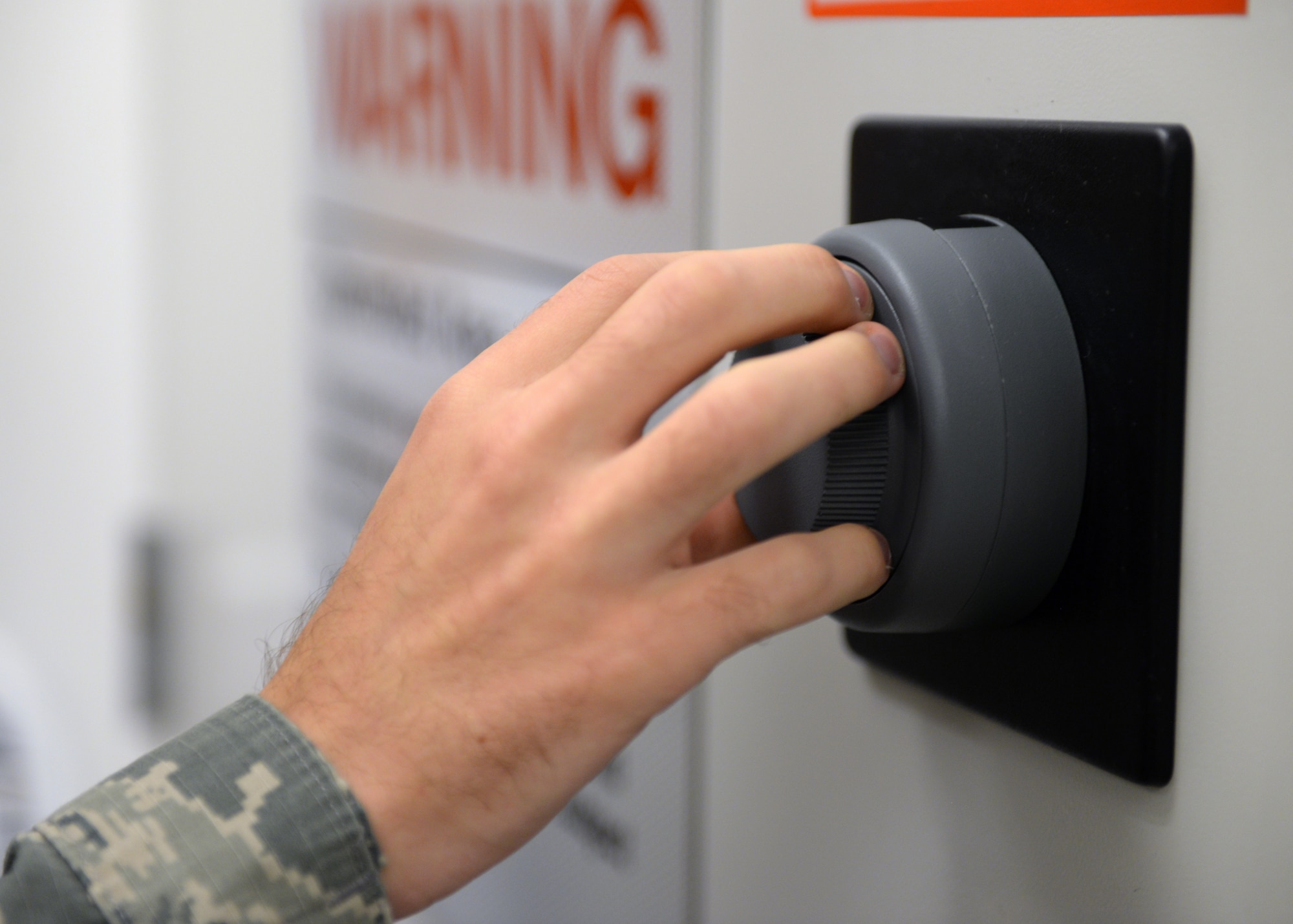 Senior Airman Tyler R. Stagland, 9th Communications Squadron information system security officer, operates a lock in the cybersecurity office, on Beale Air Force Base, California, Oct. 17, 2019. Part of a cybersecurity Airmen’s job takes place in a classified processing area. (U.S. Air Force Photo by Airman Jason W. Cochran)