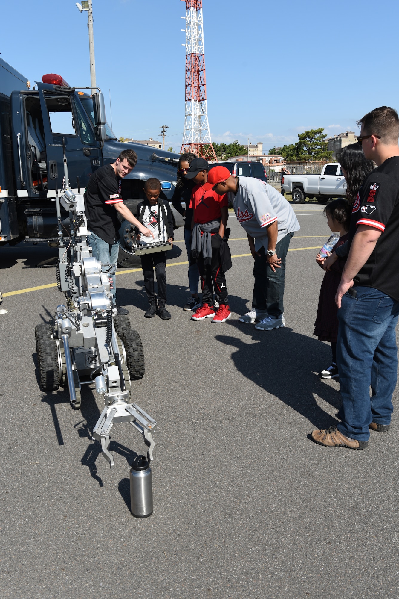 Victor Simmons controls a robot during the 2019 Penn Fest at Kunsan Air Base, Republic of Korea, Oct. 19, 2019. The 8th Civil Engineer Squadron Explosive Ordnance Disposal unit featured robots to show their use and give a better understanding of their job. (U.S. Air Force photo by Staff Sgt. Joshua Edwards)