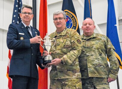 Brig. Gen. James R. Stevenson, Jr., Mobilization Assistant to the Director of Operations United States Strategic Command, presents Col. Robert "Scott" Grant, commander, 117 Air Refueling Wing, with the Omaha Trophy at Sumpter Smith Air National Guard Base, AL., Oct. 19, 2019.  The 117 ARW was the first Air National Guard tanker unit to receive the award having won it in the strategic aircraft category.  (U.S. Air National Guard photo by Master Sgt. Jeremy Farson)