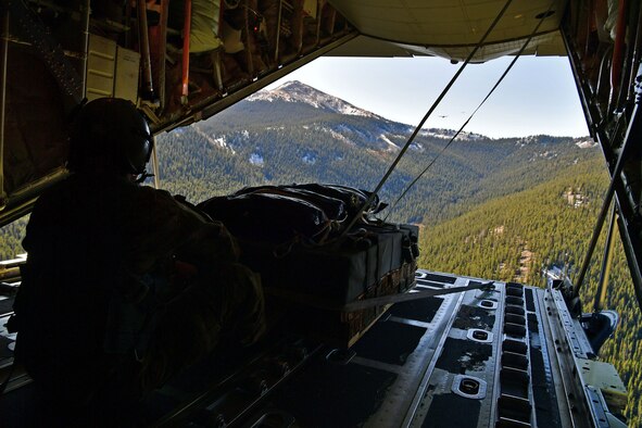 Tech. Sgt. Jonathan Parker, 815th Airlift Squadron instructor loadmaster, poses with an 815th AS, Flying Jennies, C-130J Super Hercules at Keesler Air Force Base, Miss. (U.S. Air Force photo by Jessica L. Kendziorek)