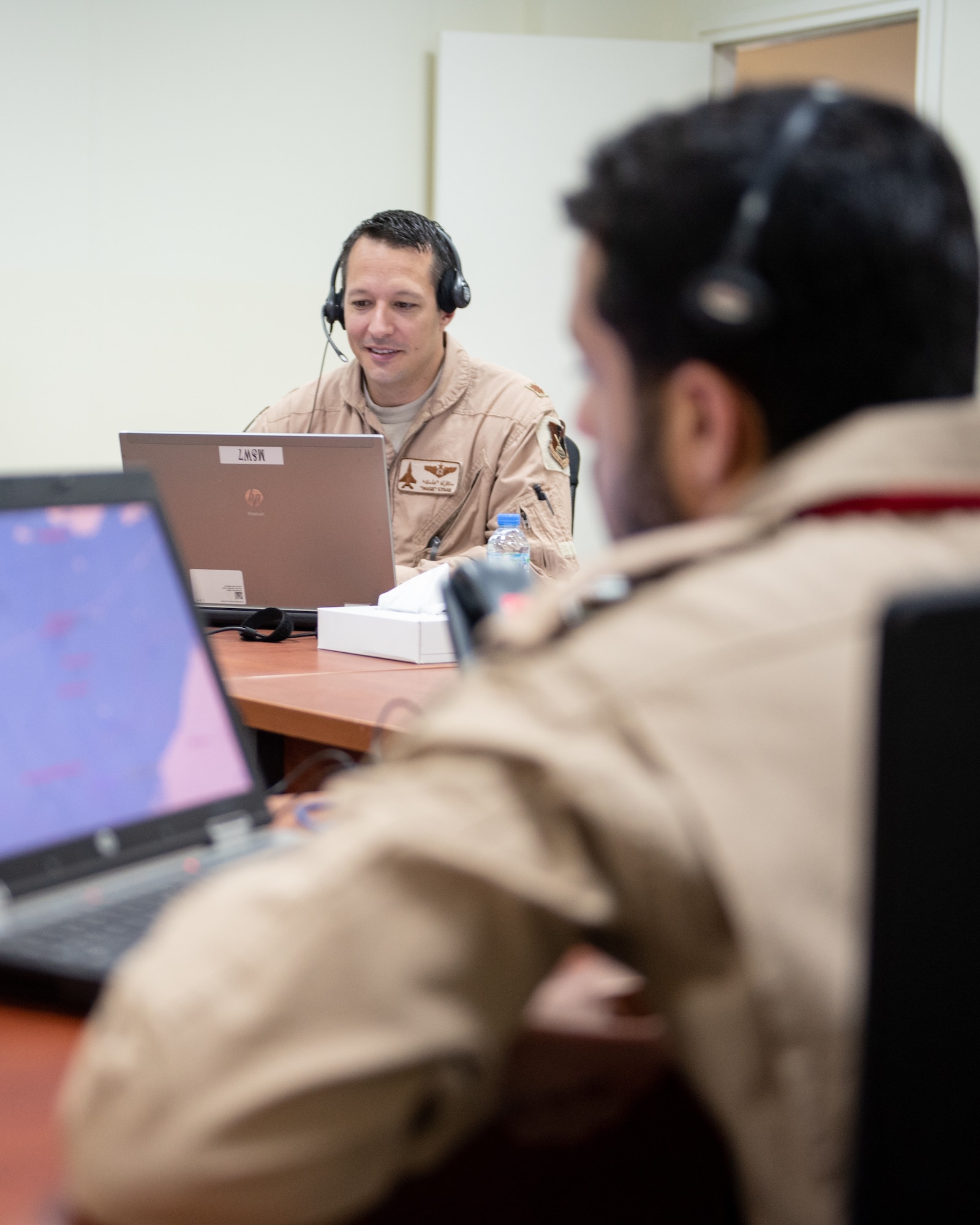 Maj. Tyler Stark, U.S. Air Forces Central Command Air Warfare Center, Air Warfare Division Chief, provides scenario support from the white cell for Exercise Falcon Shield Sept. 25, 2019, at Al Bateen Executive Airport, United Arab Emirates.