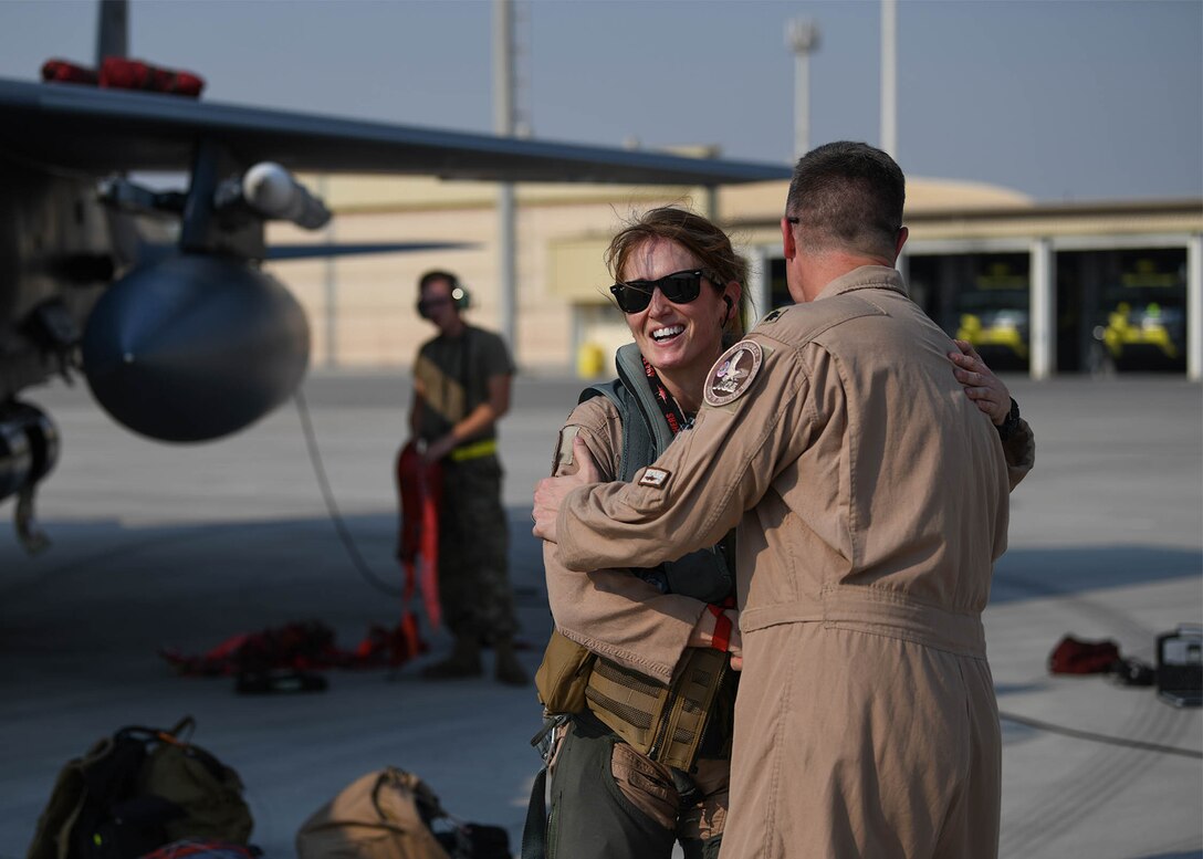 Lt. Col. Jaina Donberg, 494th Fighter Squadron commander, greets Lt. Col. Ryan Lippert, 494th FS assistant director of operations, Oct. 21, 2019, after arriving at Al Dhafra Air Base, United Arab Emirates.
