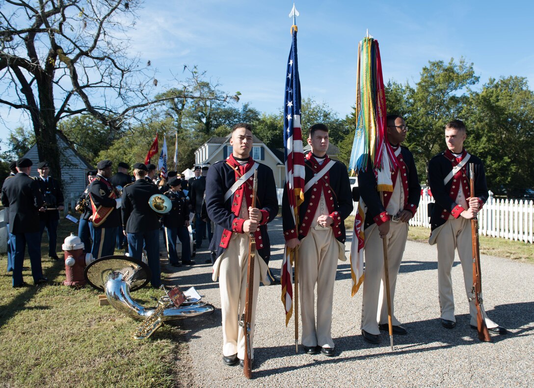 Re-enactors dressed in colonial garb, prepare to lead the Yorktown Day Parade at the Yorktown Battlefield, Virginia, Oct. 19, 2019. The parade is an opportunity for families to spend the morning together, watching members from the military branches and local organizations march. (U.S. Air Force photo by Airman 1st Class Sarah Dowe)