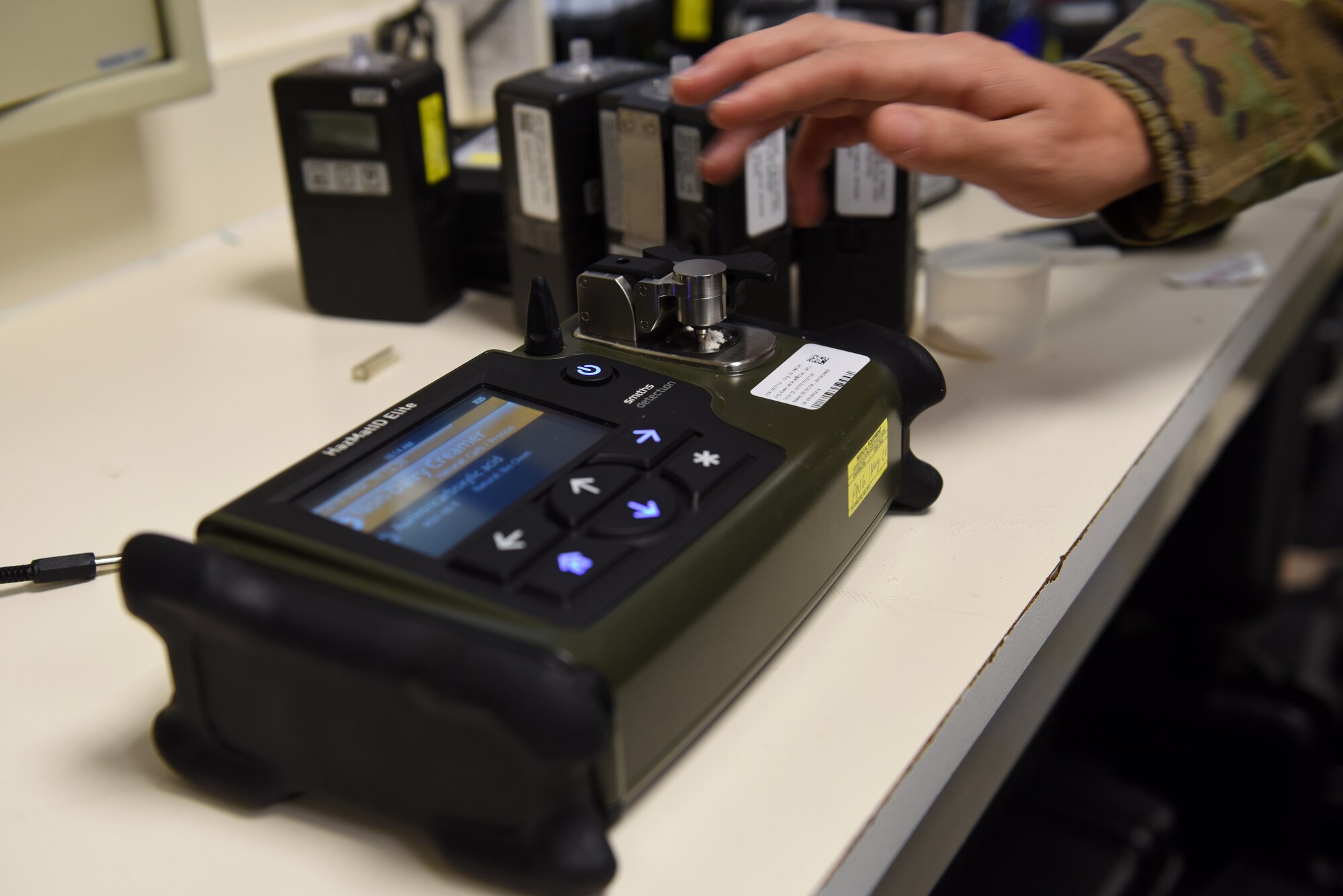 Senior Airman Enzo Guastavino, bioenvironmental technician assigned to the 48th AMDS, performs a chemical analysis test recently on the HazMatID Chemical Identifier at Royal Air Force Lakenheath, England. The HazMatID Chemical Identifier takes less than one minute to analyze a small amount of unknown substance on to the diamond attenuated total reflection sensor and applies pressure with an integrated press for solid samples. (U.S. Air Force photo by Airman 1st Class Rhonda Smith)