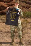 U.S. Army Spc. Samantha Coleman, a motor transport operator with the 2220th Transportation Company in Tucson, Ariz., poses with her All-Army Women’s Rugby Team jersey at Papago Park Military Reserve Oct. 20, 2019. Coleman says she has found a deep sense of family and belonging in both the Army and her rugby team.